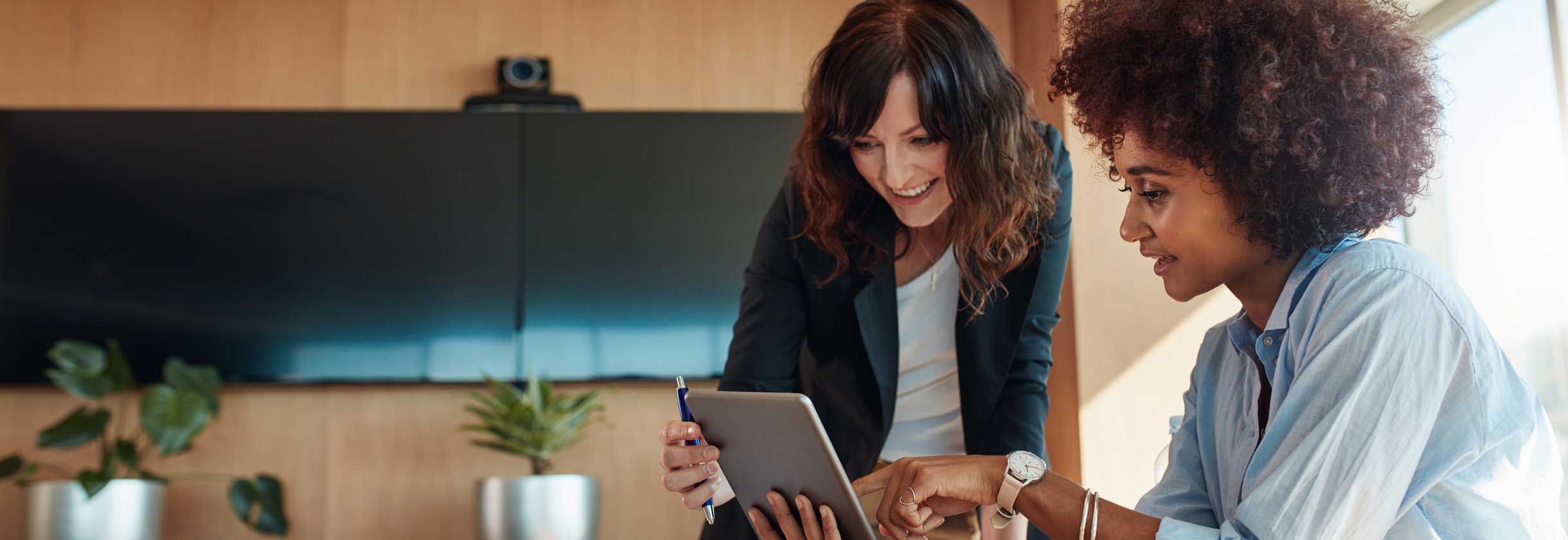 Small business owners working on tablet